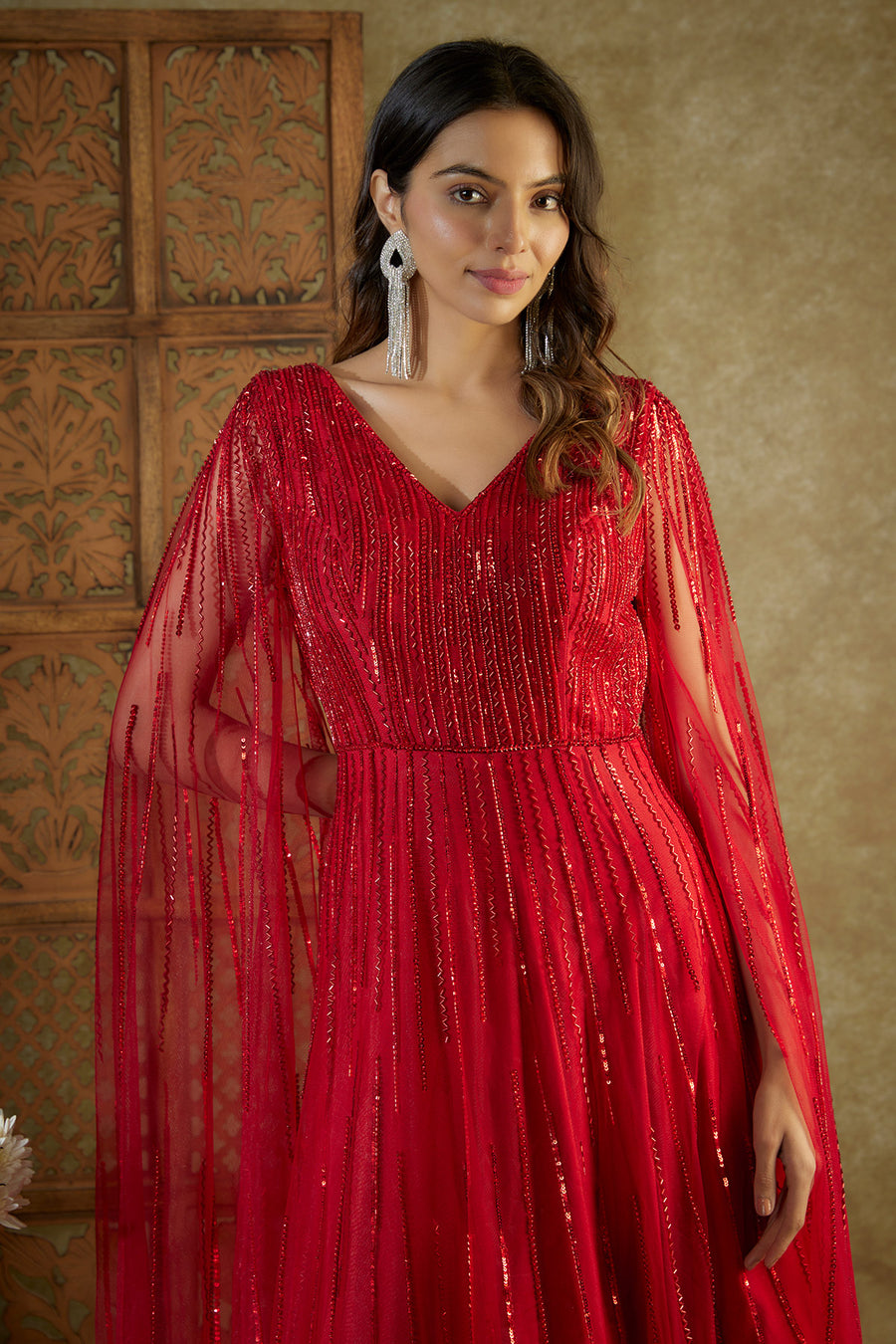Red embroidered cocktail gown with cape sleeves