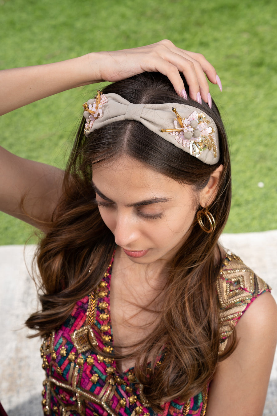 Beige Headband With Gold And Pink Embellishments